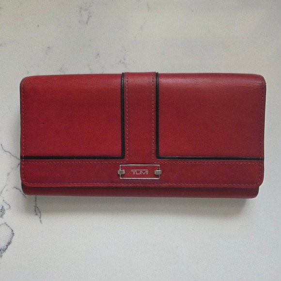 Tumi Handbags - Tumi Red Leather Continental Wallet Clutch RFID Lock Black Trim Snap Closure